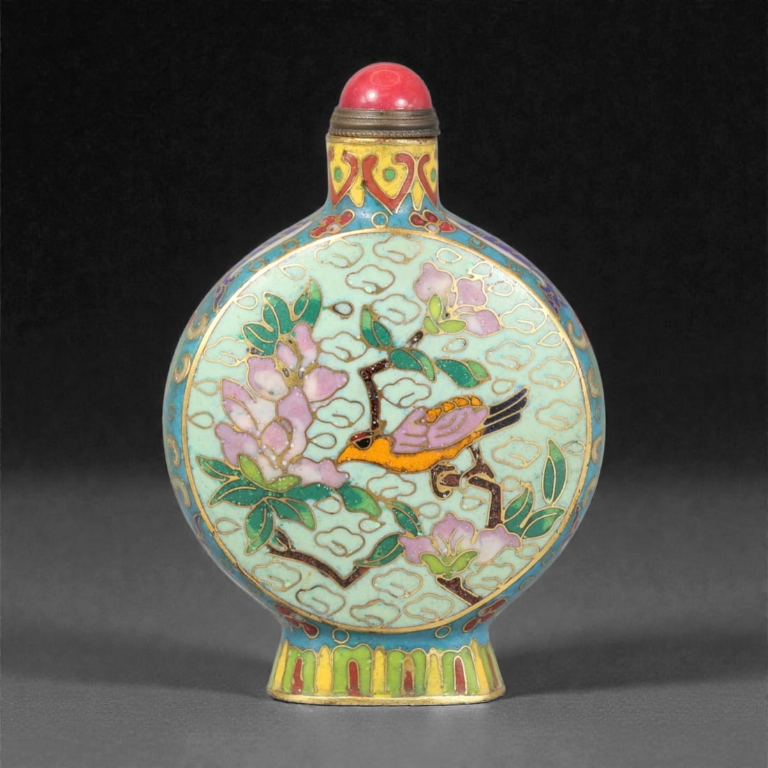 A Chinese Cloisonne Enamel Snuff Bottle, 20th Century, 19YC: Constructed from metal and decorated in cloisonne enamel, the bottle is of compressed globular form with rounded sides rising to a short cylindrical neck and flared foot. The surface is articulated wi