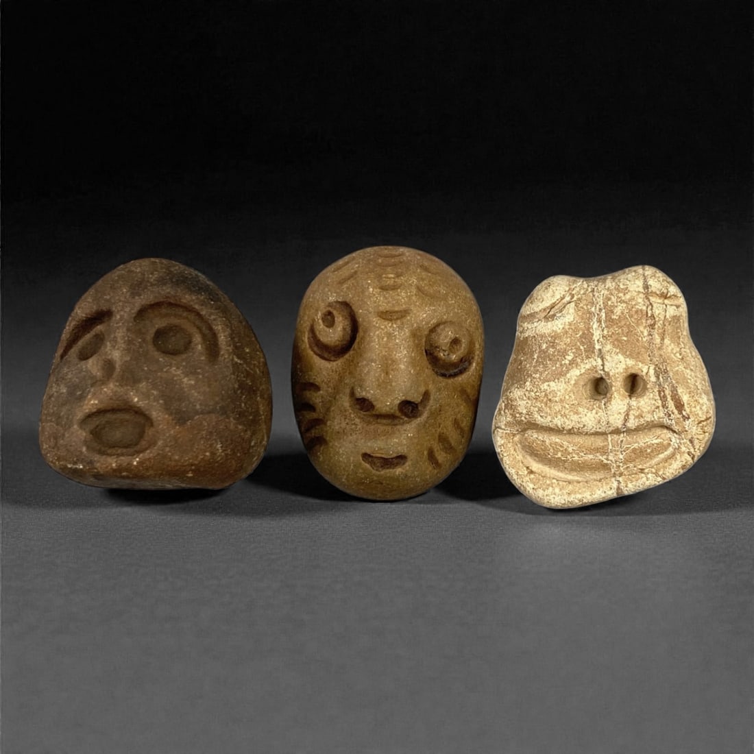 A Group of Three Medieval Stone Maskette Amulets, 10th-14th Century, 53FP (1 of 1)
