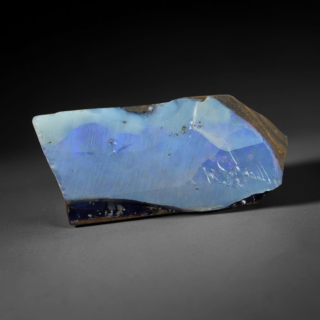 22.48 Carats Winton Boulder Opal Rough Slab - Natural Australian Stone, 44XP: This elegant Winton boulder opal rough slab showcases a luminous band of soft sky-blue and pale lavender play-of-color, with subtle hints of violet iridescence that glow gently under light. Measuring
