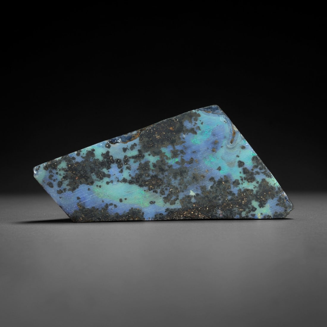 35.06 Carats Winton Boulder Opal Rough Slab - Natural Australian Stone, 38XP: This impressive 35.06ct Winton boulder opal rough slab features a dynamic mosaic of luminous peacock blue and seafoam-green iridescence, interwoven with intricate ironstone matrix patterns. Measuring