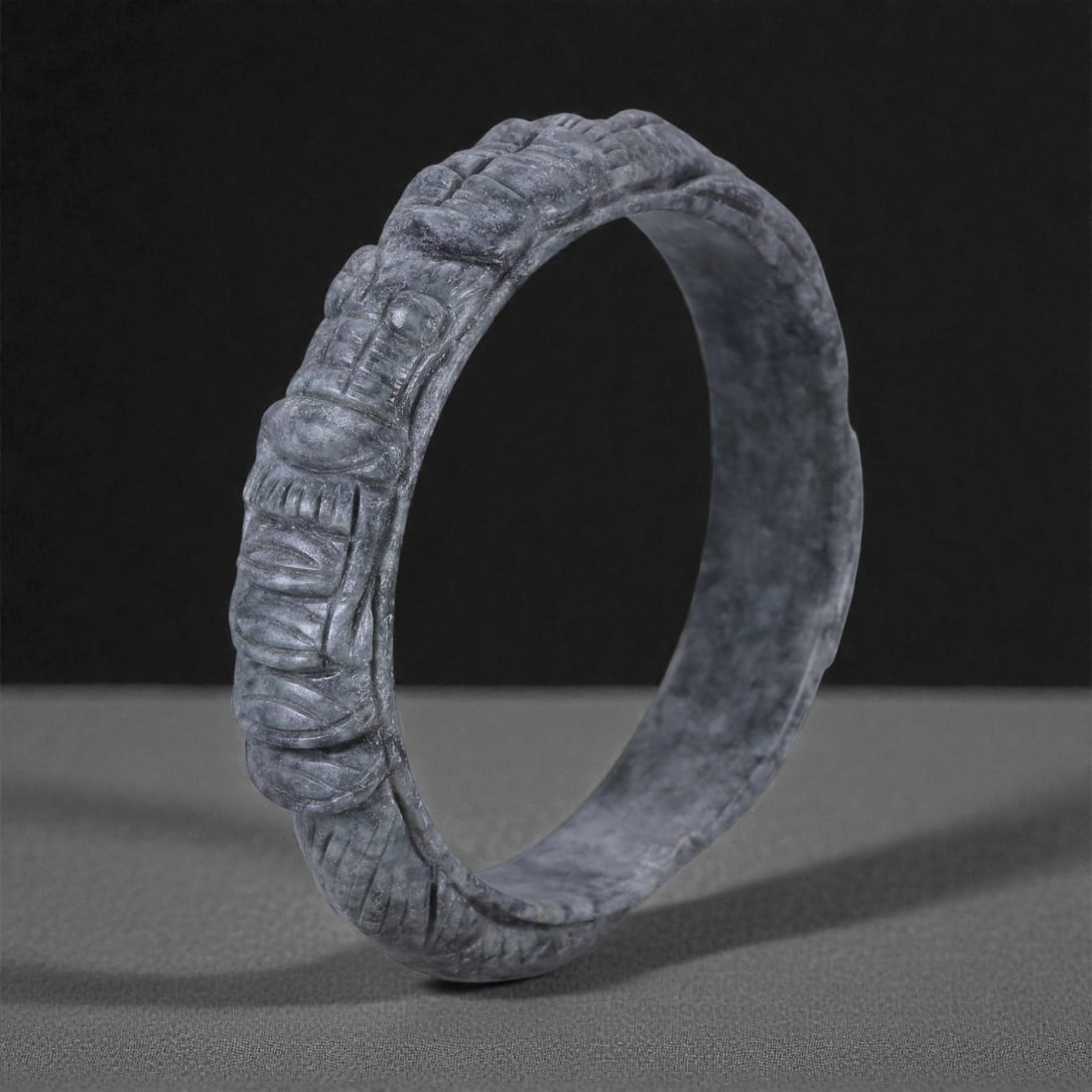 Jadeite Jade Dragon Bracelet - Carved Asian Bangle, 6.3cm Inner Diameter, 28WE: Carved from dense grey-green jadeite, this bracelet is formed as a continuous circular bangle with sculptural relief carving along the exterior surface. The stone has been hollowed and shaped through