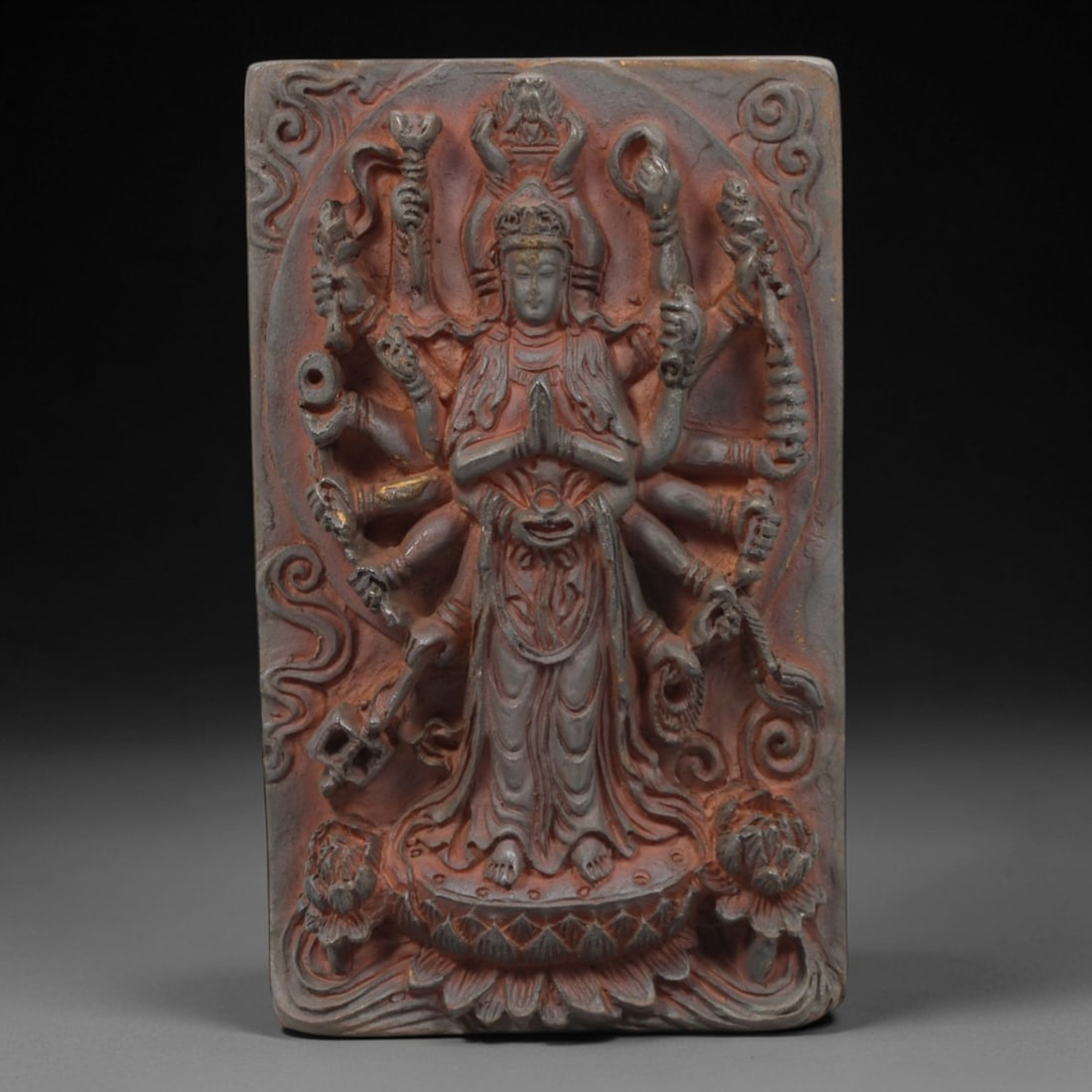 A Chinese Horn or Bone Thousand-Armed Guanyin Plaque, 20th Century, 89FV: Carved from horn or bone with a naturally aged, patinated surface and subtle tonal variations, the plaque is rectangular in form, depicting Thousand-Armed Guanyin in high relief. The deity is shown st