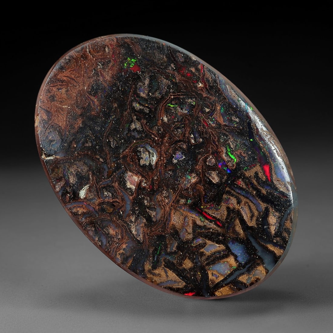 3.37 Carats Koroit Yowah Opal Cabochon - Natural Australian Single Stone, 77XL: This striking Koroit Yowah opal cabochon, measuring 12.5x8.8mm, features a dense, textured ironstone matrix in layered tones of deep chocolate brown, warm tan, and jet black. The stone's internal land