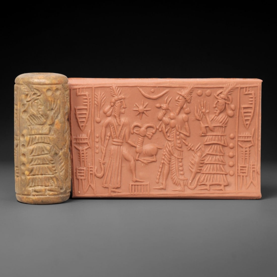 Ancient Steatite Cylinder Seal - Mesopotamian Ritual Procession & Ibex Scene, 7ZP: Carved from warm, golden-brown steatite, this ancient Mesopotamian cylinder seal depicts a rich ritual procession scene, executed with meticulous glyptic craftsmanship characteristic of the Neo-Assyri