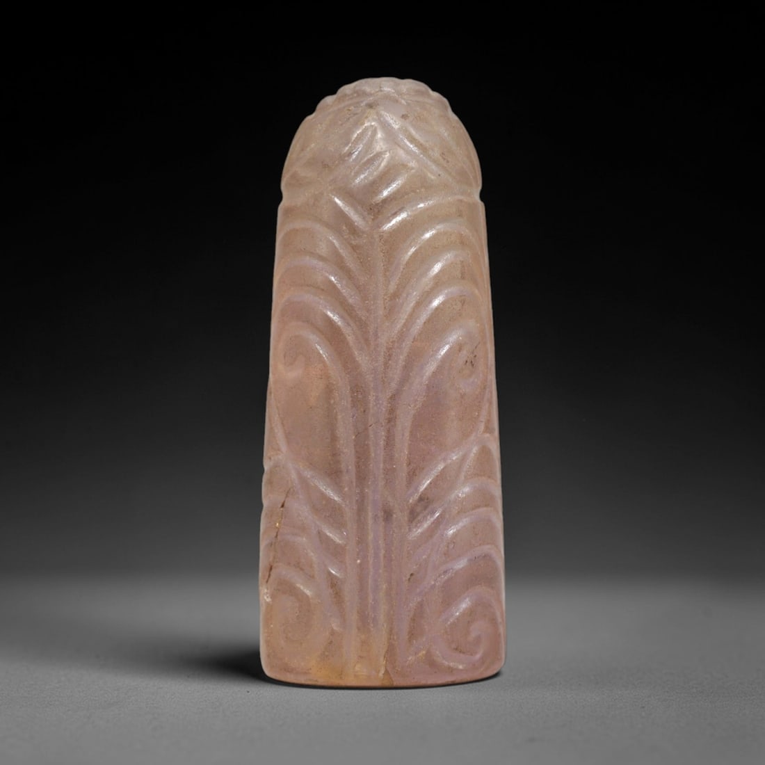 Ancient Amethyst Relic - Medieval Egyptian Figurine, 77ZP: Carved from translucent pale amethyst, this relic features a symmetrical, tapering form with deeply incised vegetal motifs-including stylized palm fronds and swirling scrolls-rendered in relief across
