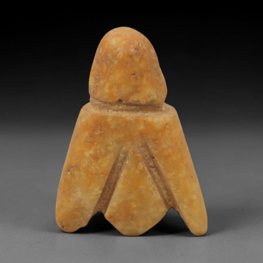 Ancient Stone Fly - Egyptian Amulet Pendant, 22XR: Carved from warm orange-brown stone, this amulet depicts a stylized fly with a domed head, narrow neck, and broad, wing-like lower body terminating in a split tail. The form and iconography are charac