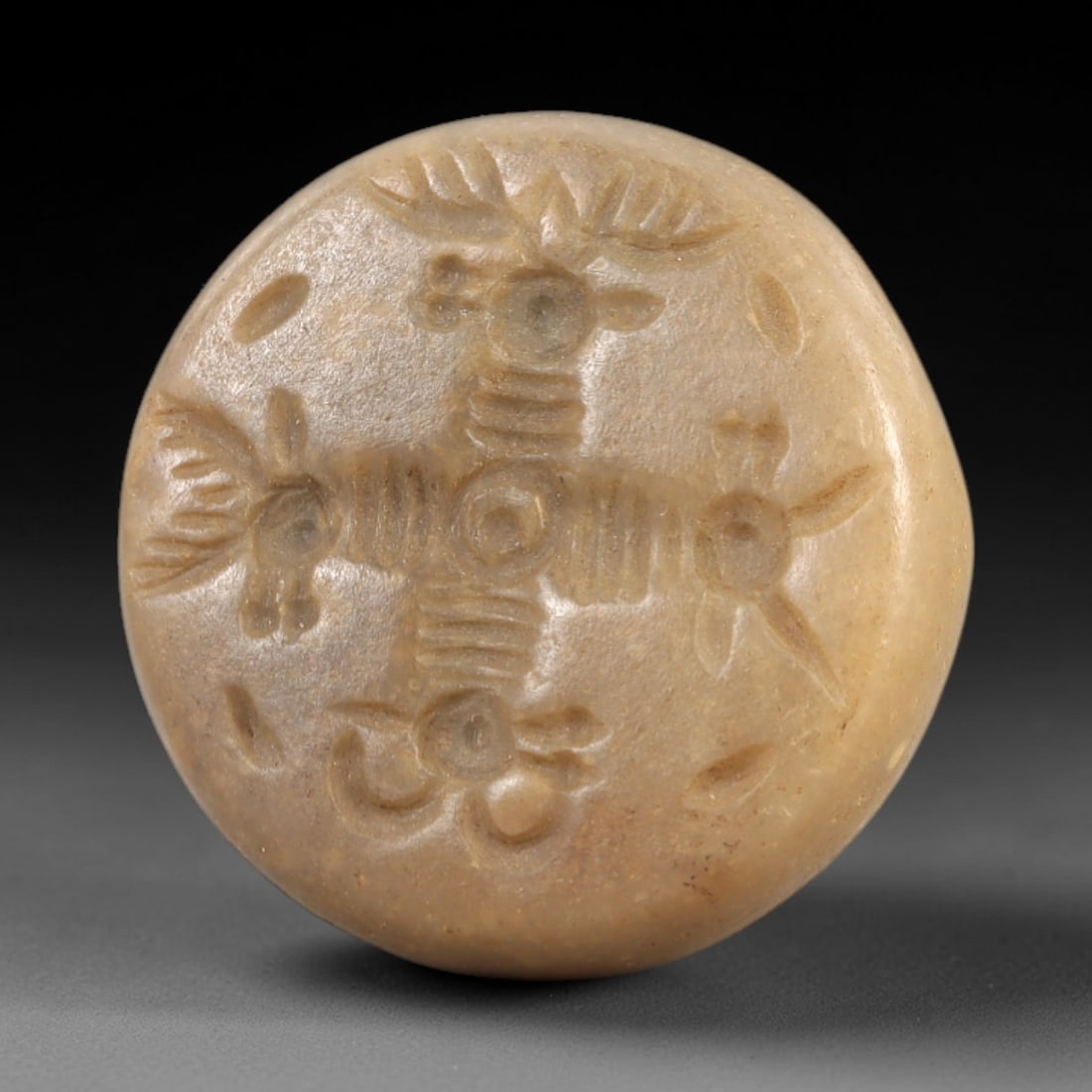 Ancient Stone Stamp Seal - Near Eastern Zoomorphic Glyptic, 15AL: This hemispherical stamp seal is carved from smooth, light-toned stone, its flat face featuring a symmetrical cross-shaped composition of four zoomorphic motifs, each with distinct antlered, horned, o