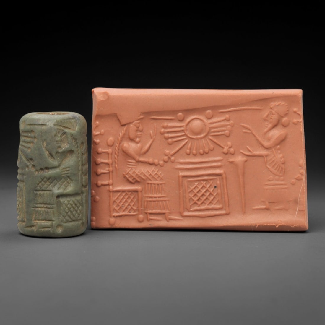 Ancient Steatite Cylinder Seal - Mesopotamian Sun Deity Audience Scene, 59AL: Carved from muted green steatite, this ancient Mesopotamian cylinder seal depicts a formal audience scene centered on the sun deity Shamash, executed with precise glyptic craftsmanship characteristic