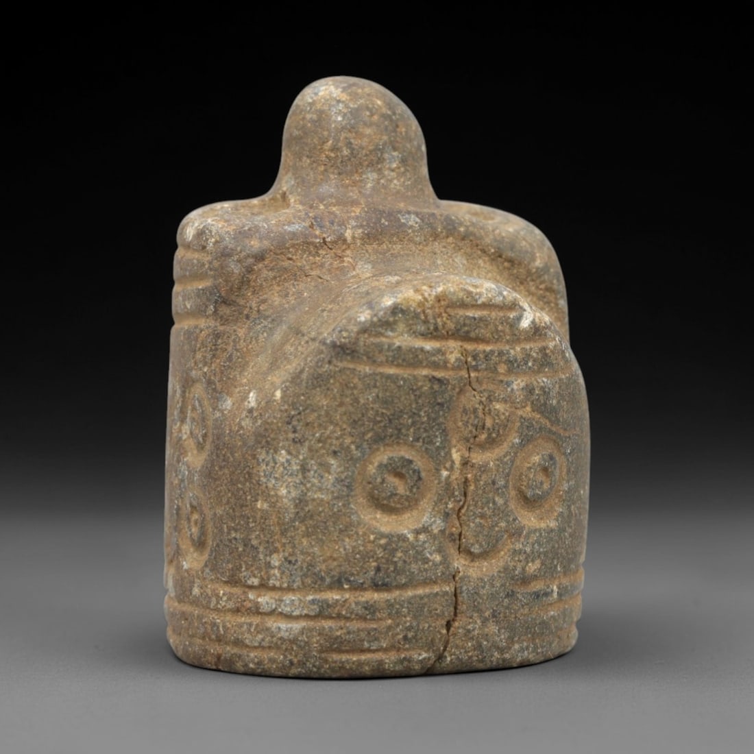 Ancient Stone Anthropomorphic Idol - South Asian Ritual Figurine, 19ZR: This artifact is a carved stone anthropomorphic idol, executed in the stylized religious tradition of ancient South Asia. The idol features a compact, blocky form with a rounded top knob, incised hori