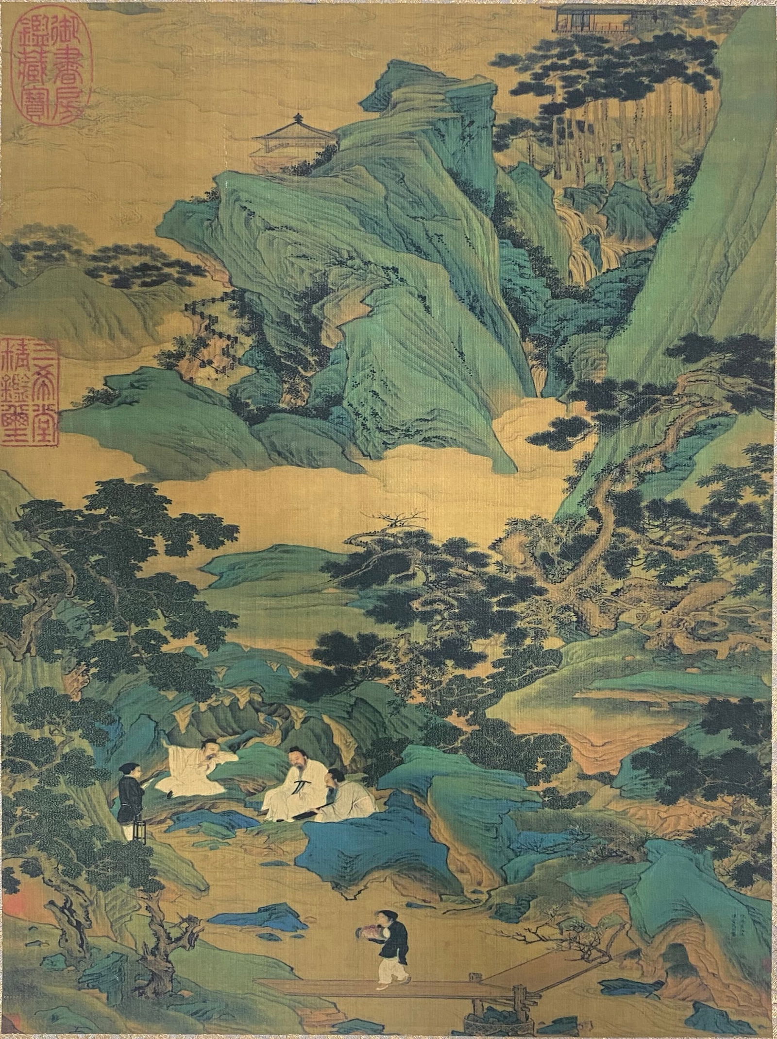 A Chinese Ink and Color Art Print, Scholars in a Blue-Green Landscape, 20th Century, 18FV: Printed on a warm, golden silk or paper ground, the composition depicts a grand blue-green landscape in the classical Chinese literati style. Layered, jagged mountains in vibrant turquoise and emerald