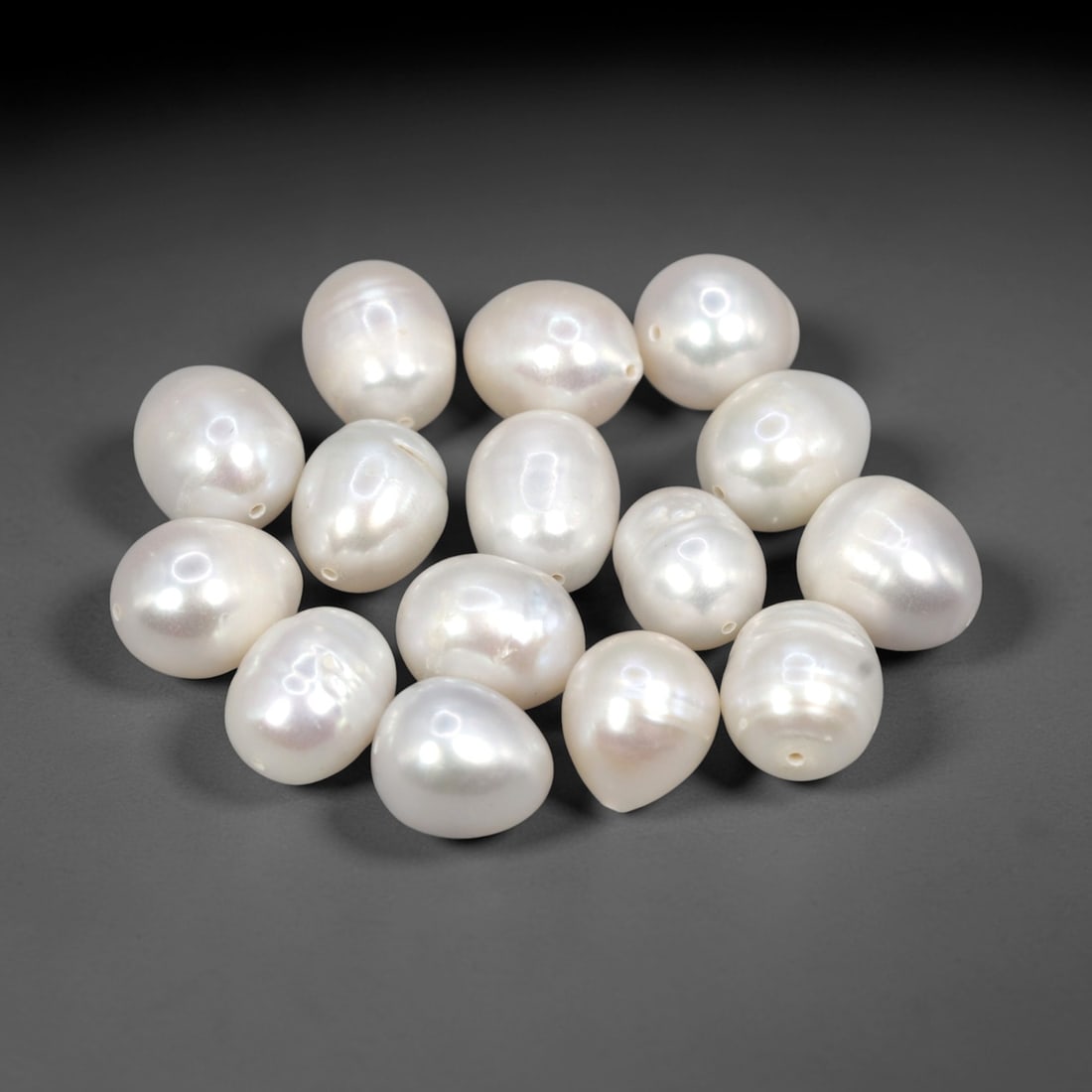 Baroque Freshwater Pearls - 10-13mm Loose Bead Set, 16AK: Crafted from natural freshwater pearl, this set of fifteen baroque pearls exhibits irregular, oval and teardrop forms with a lustrous, iridescent white surface. Each pearl is drilled for jewelry makin