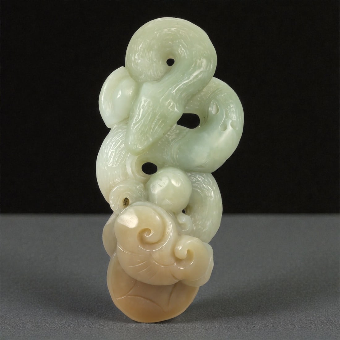 A Chinese Jade Intertwined Serpents and Lingzhi Pendant, 20th Century, 36YA (1 of 2)