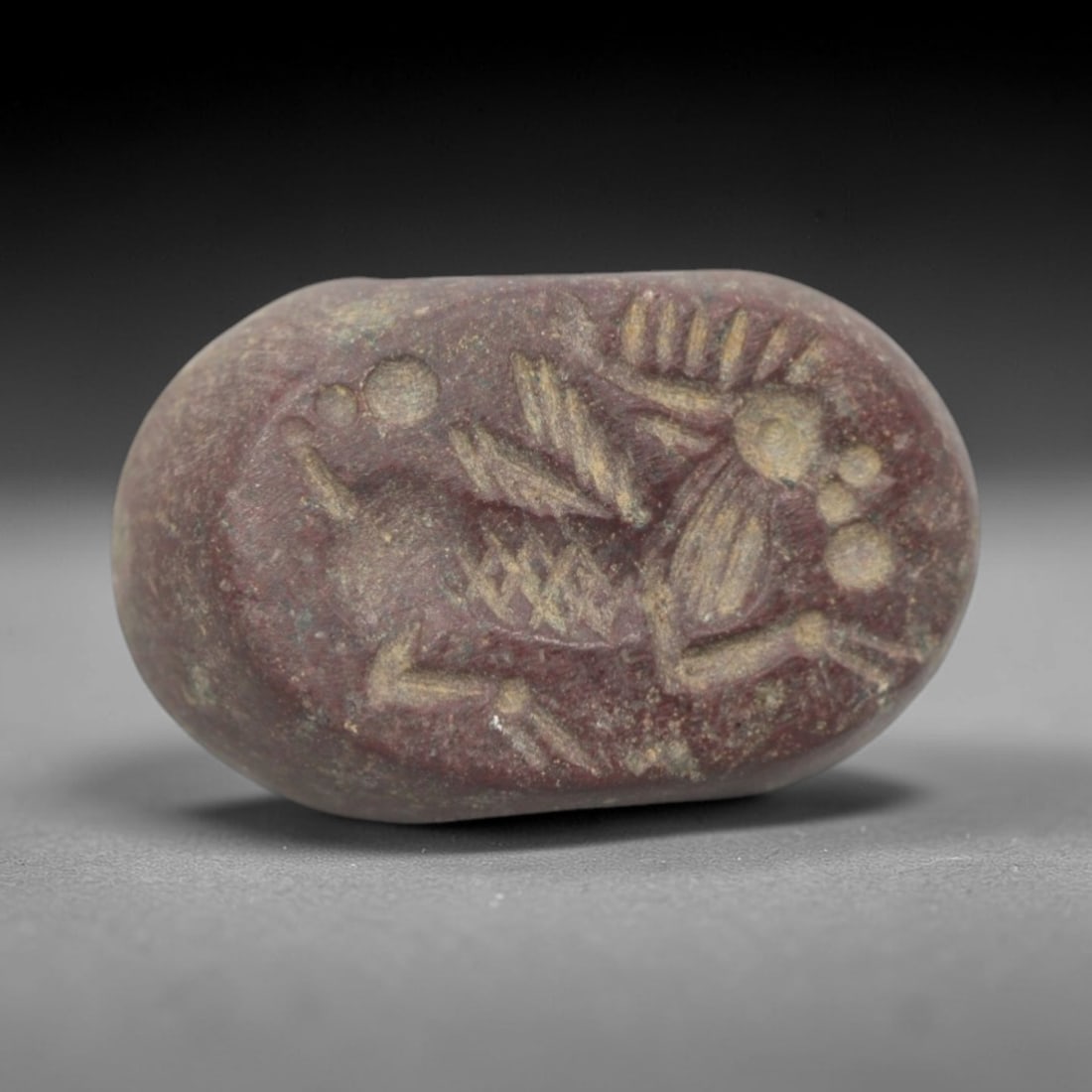 Ancient Stone Hemispherical Stamp Seal - Near Eastern Mythical Hybrid Figure, 92ZS: Crafted from dense, reddish-brown stone, this hemispherical stamp seal bears incised carving of a mythical hybrid creature, likely a winged equine or chimera, with a stylized head, radiating appendage