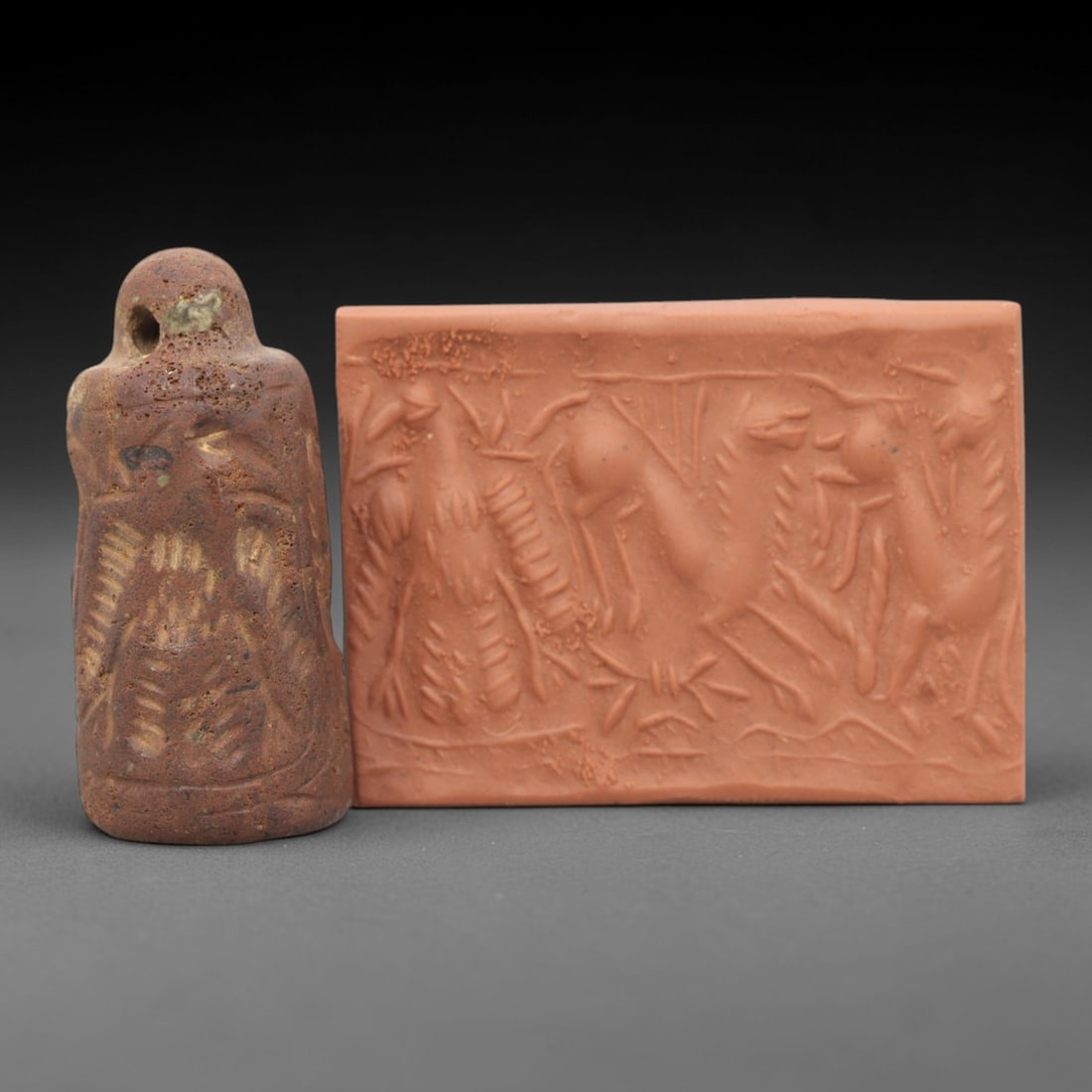 Ancient Steatite Cylinder Seal - Mesopotamian Animal Procession Scene, 90ZR: Carved from dense steatite, this ancient Mesopotamian cylinder seal features a dynamic linear relief composition of animal figures in procession, executed in the characteristic glyptic style of the Ne