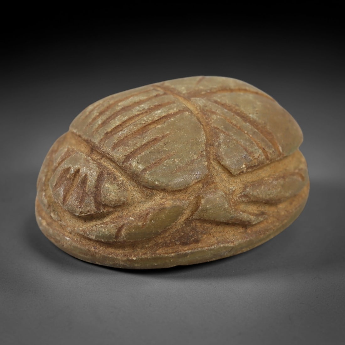 Ancient Serpentine Scarab - Egyptian Amulet Figurine, 24AL: This scarab amulet is carved from serpentine, its domed form detailed with incised lines defining the elytra, legs, and head-iconographic elements characteristic of Egyptian funerary and ritual scarab