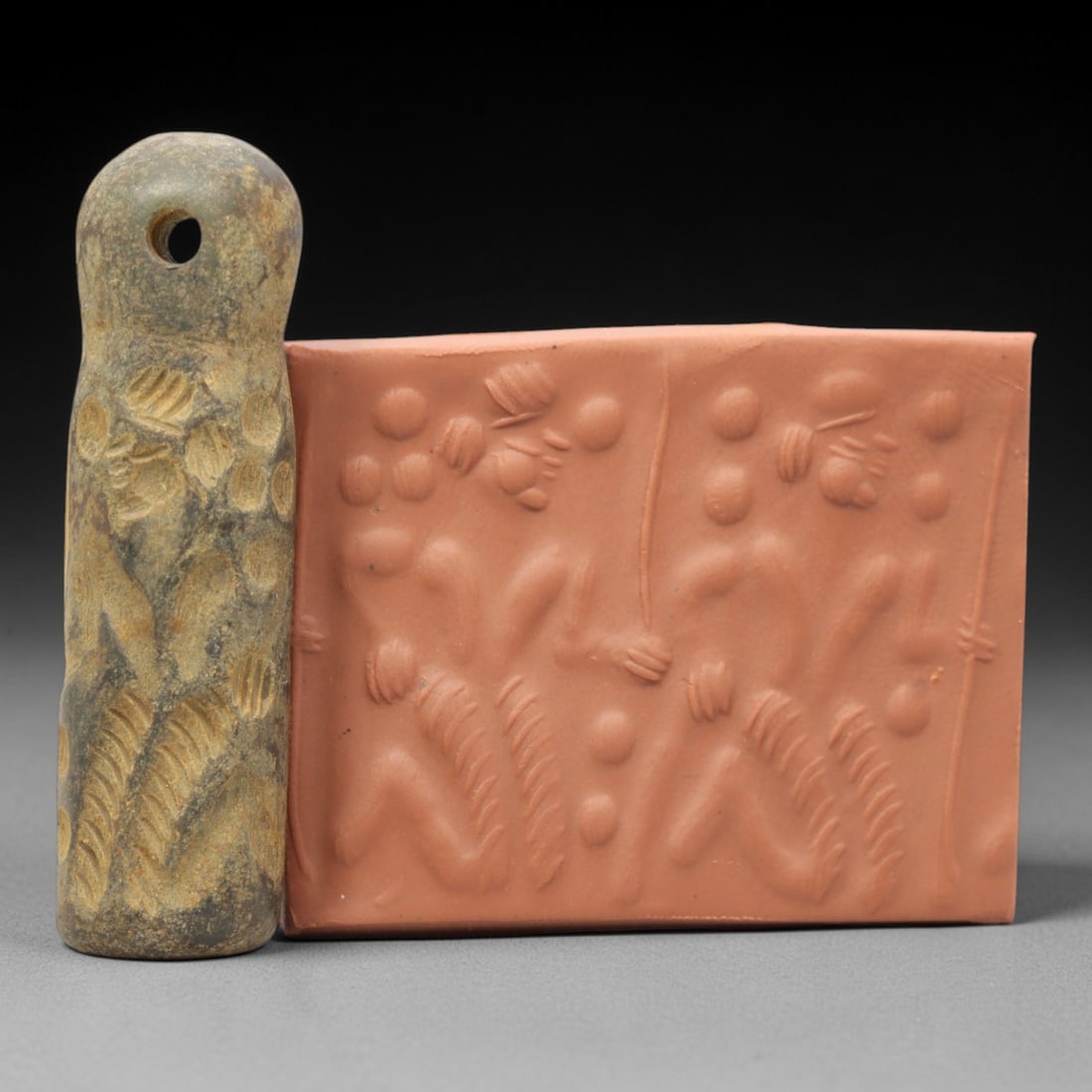 Ancient Serpentine Cylinder Seal - Mesopotamian, 63ZT: Carved from serpentine, this cylinder seal follows the classic cylindrical form of ancient Mesopotamian administrative and ritual artifacts. Attributed to the Bronze Age Mesopotamian cultures, this se