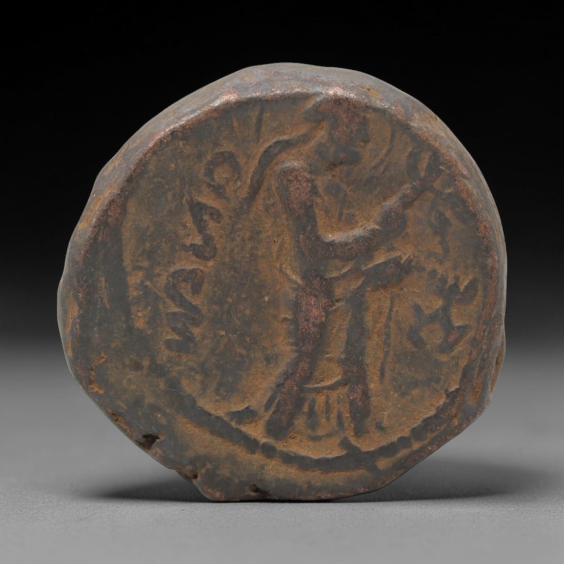 KUSHAN EMPIRE: Royal Warrior - Bronze Coin, 2nd-3rd Century CE, 25mm, 17.3g, 95AJ: This substantial bronze coin from the Kushan Empire showcases the dynasty's iconic warrior motif, a powerful symbol of royal authority and military prowess. The obverse features a dynamic royal figure