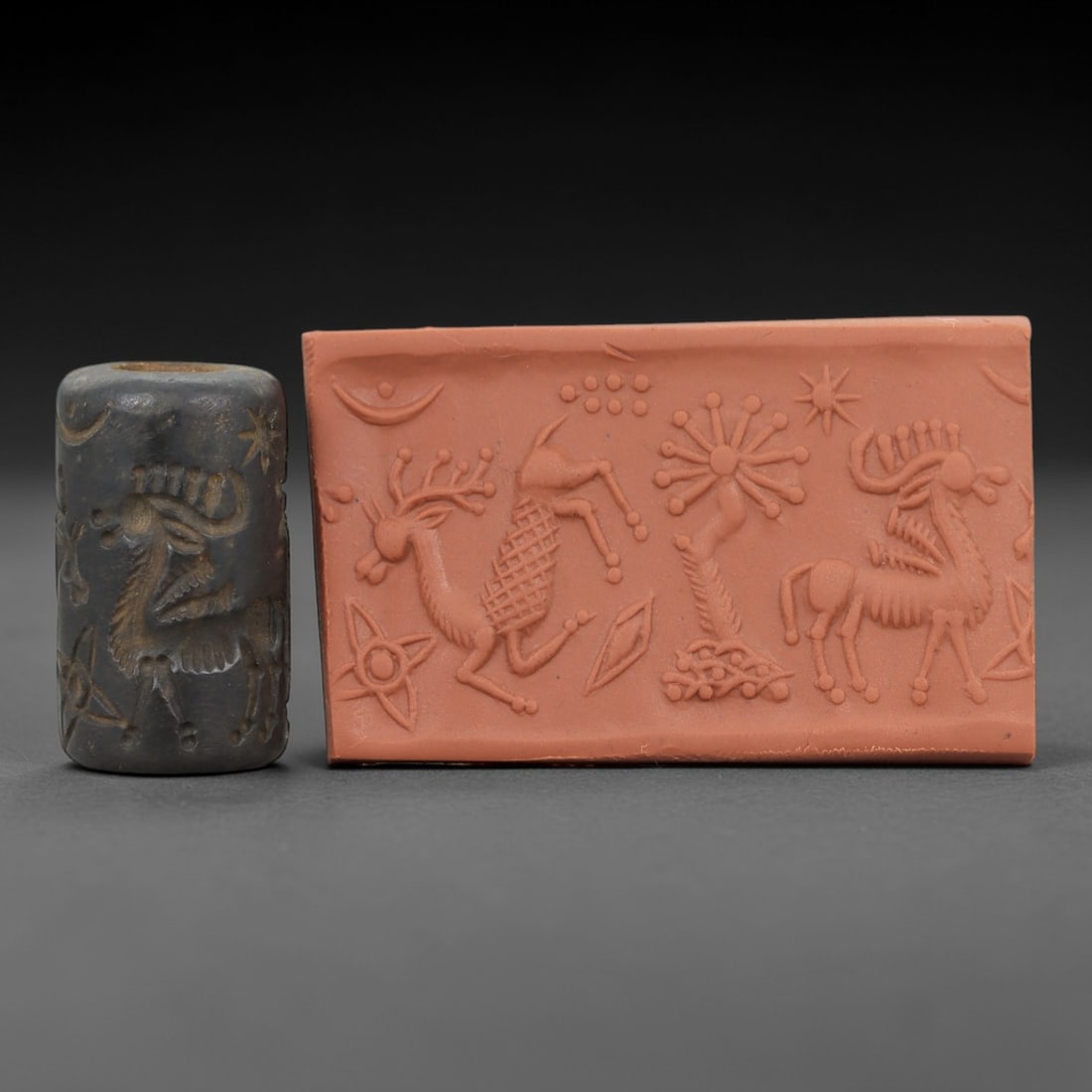 Ancient Steatite Cylinder Seal - Mesopotamian Animal Motif, 8ZP: Crafted from dense, dark steatite, this ancient Mesopotamian cylinder seal bears deeply incised animal and celestial motifs, executed with the precise hand-carving characteristic of Mesopotamian glypt