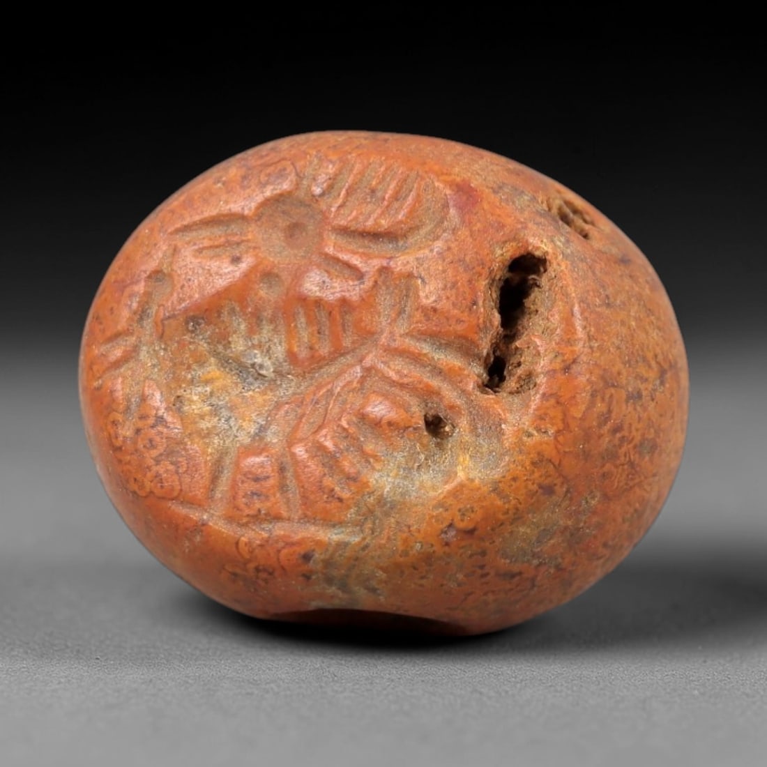 Ancient Jasper Stamp Seal - Near Eastern Bird Figure, 90AM: Carved from weathered orange-brown jasper, this hemispherical stamp seal depicts a stylized avian figure with incised linear details defining its plumage, beak, and body structure. The iconography ref
