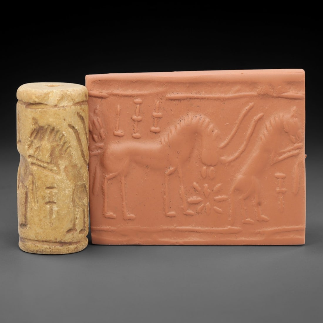 Ancient Steatite Cylinder Seal - Near Eastern Carving, 99AG: Carved from steatite stone, this ancient Near Eastern cylinder seal features a cylindrical form with raised relief carvings depicting human figures and geometric patterns. The seal exhibits the fine c