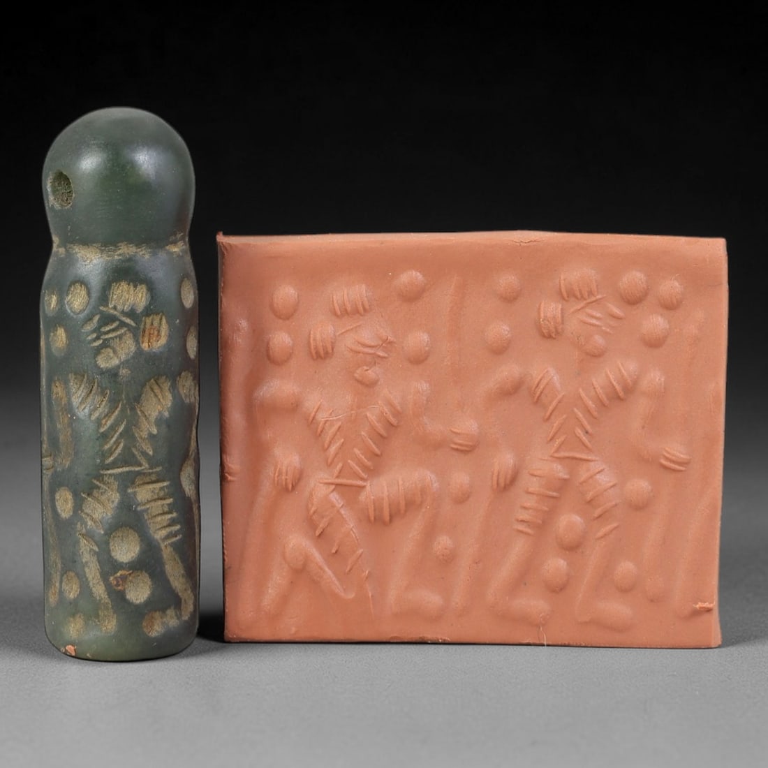 Ancient Serpentine Cylinder Seal - Mesopotamian, 64FX: Carved from serpentine, this cylinder seal follows the classic cylindrical form of ancient Mesopotamian administrative and ritual artifacts. Attributed to the Bronze Age Mesopotamian cultures, this se
