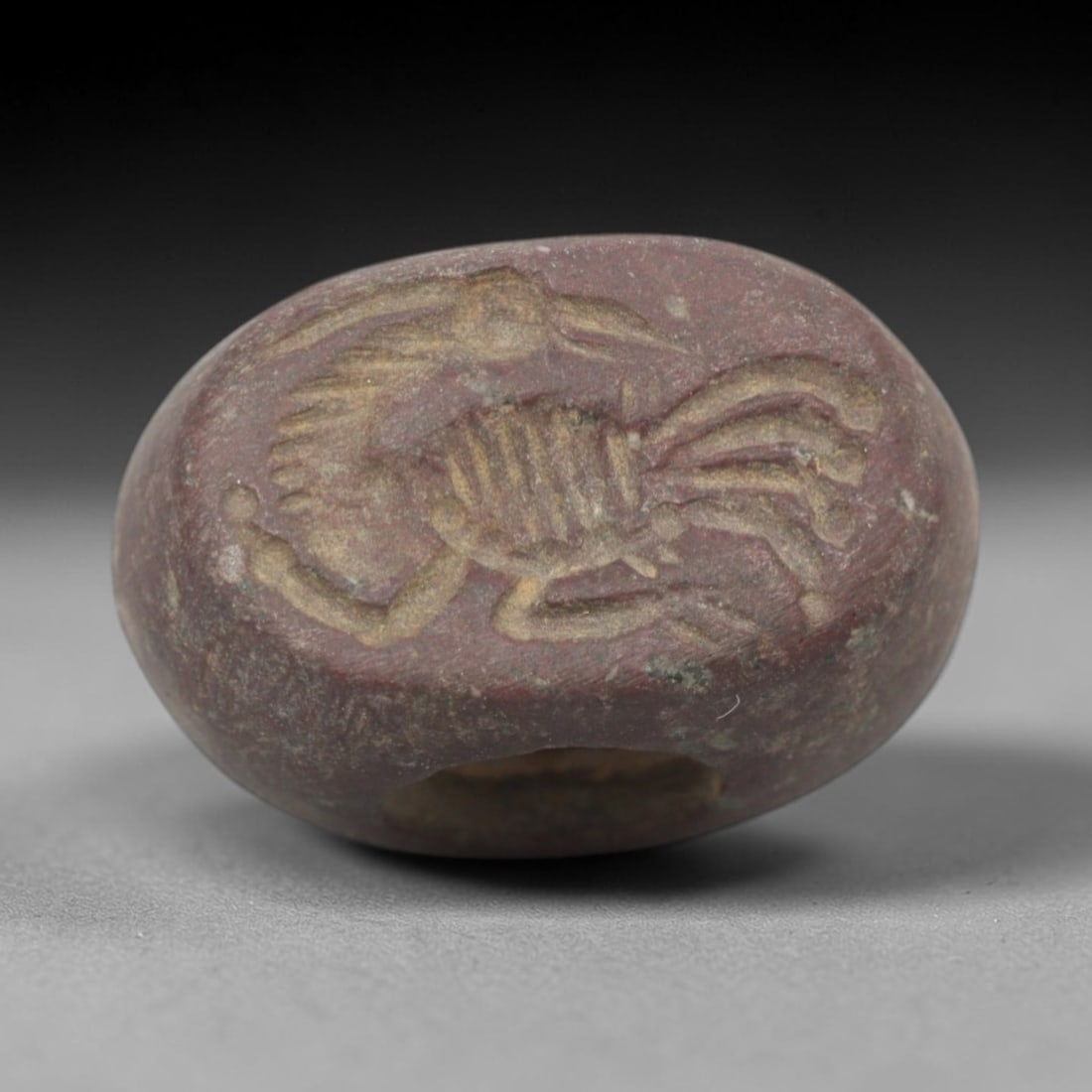 Ancient Stone Hemispherical Stamp Seal - Near Eastern Scorpion Figure, 84ZS: Crafted from dense, reddish-brown stone, this hemispherical stamp seal bears incised carving of a detailed scorpion figure, with segmented body, raised pincers, curved tail, and linear limb motifs cha