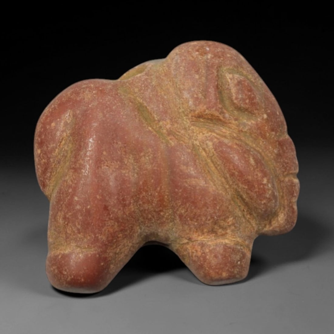 Ancient Red Sandstone Elephant - Indus Valley Amulet, 61XP: Carved from compact red sandstone, this miniature amulet depicts a stylized elephant, a motif central to the iconography of the Indus Valley Civilization. The carving employs robust, rounded forms to