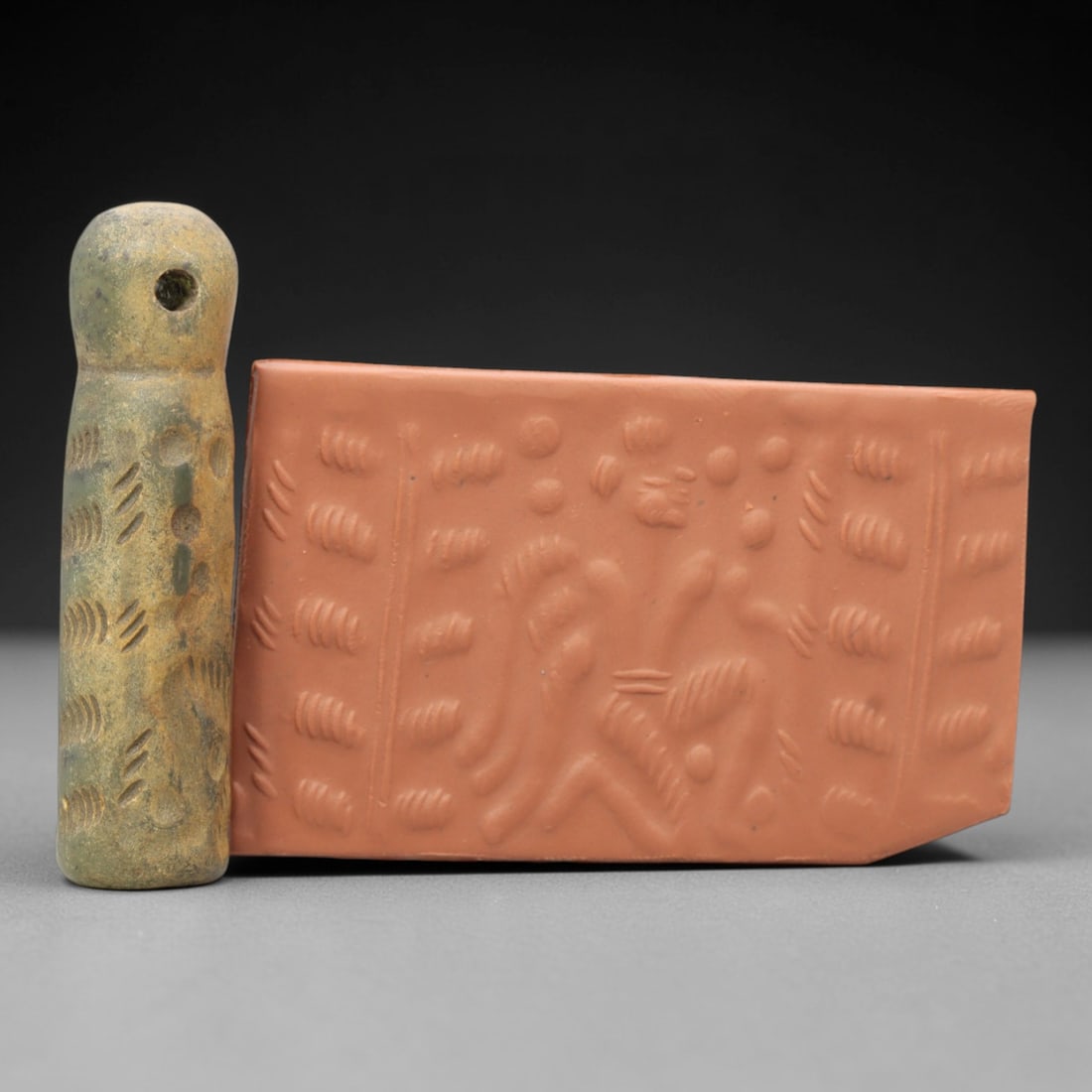 Ancient Serpentine Cylinder Seal - Mesopotamian, 50ZT: Carved from serpentine, this cylinder seal follows the classic cylindrical form of ancient Mesopotamian administrative and ritual artifacts. Attributed to the Bronze Age Mesopotamian cultures, this se