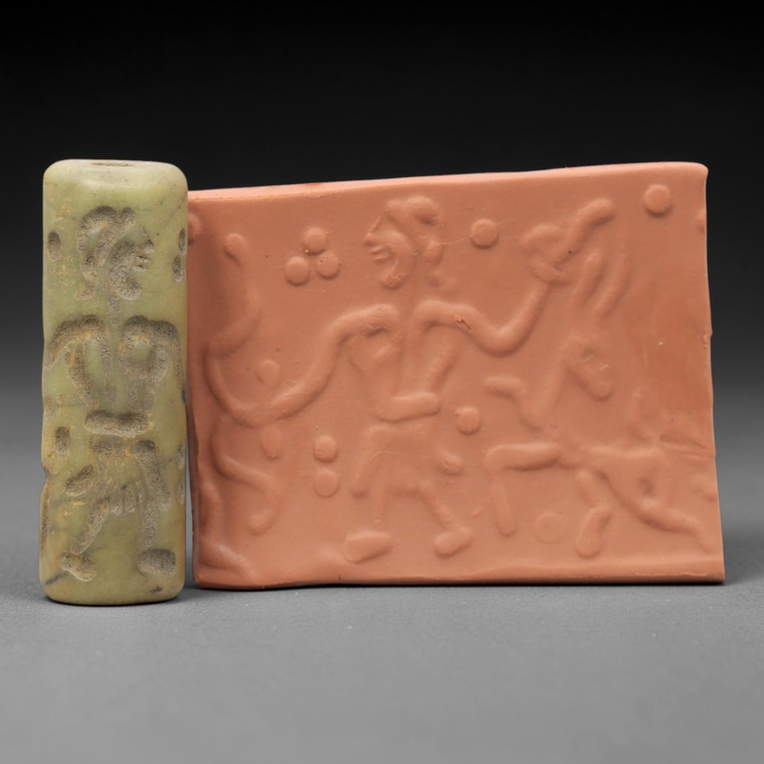 Ancient Serpentine Cylinder Seal - Mesopotamian, 40ZT: Carved from serpentine, this cylinder seal follows the classic cylindrical form of ancient Mesopotamian administrative and ritual artifacts. Attributed to the Bronze Age Mesopotamian cultures, this se