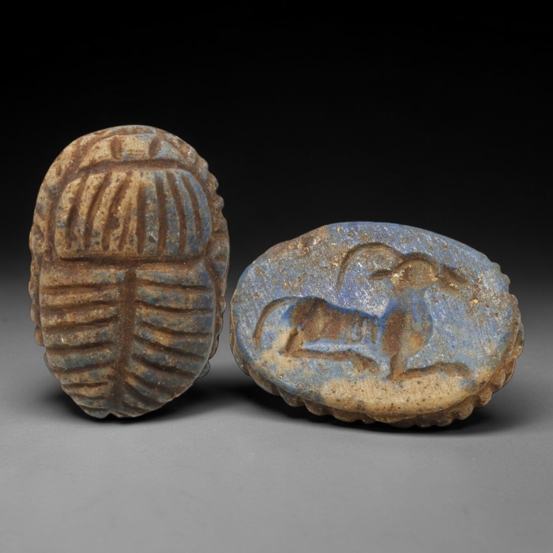 Ancient Lapis Lazuli Scarab - Near Eastern Ibex Zoomorphic Seal, 28XT: This artifact is hand-carved from lapis lazuli, employing traditional ancient lapidary techniques consistent with Near Eastern Bronze Age seal craftsmanship. The object takes the form of a scarab beet