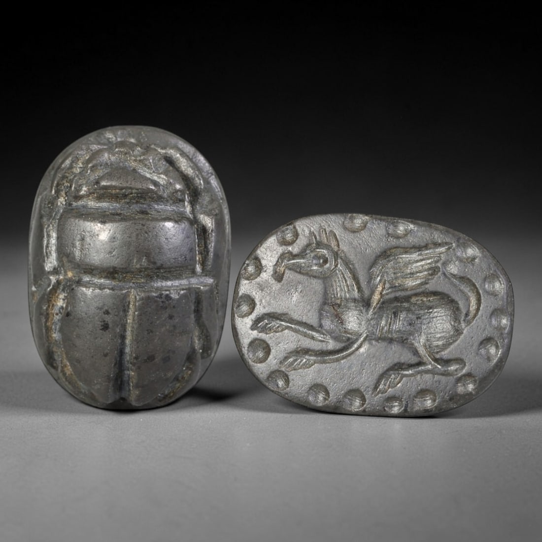 Ancient Hardstone Scarab - Near Eastern Hippocampus Seal, 63AS: This artifact is hand-carved from a dark, fine-grained hardstone, utilizing traditional ancient seal craftsmanship consistent with Near Eastern or Phoenician Iron Age traditions. The object takes the