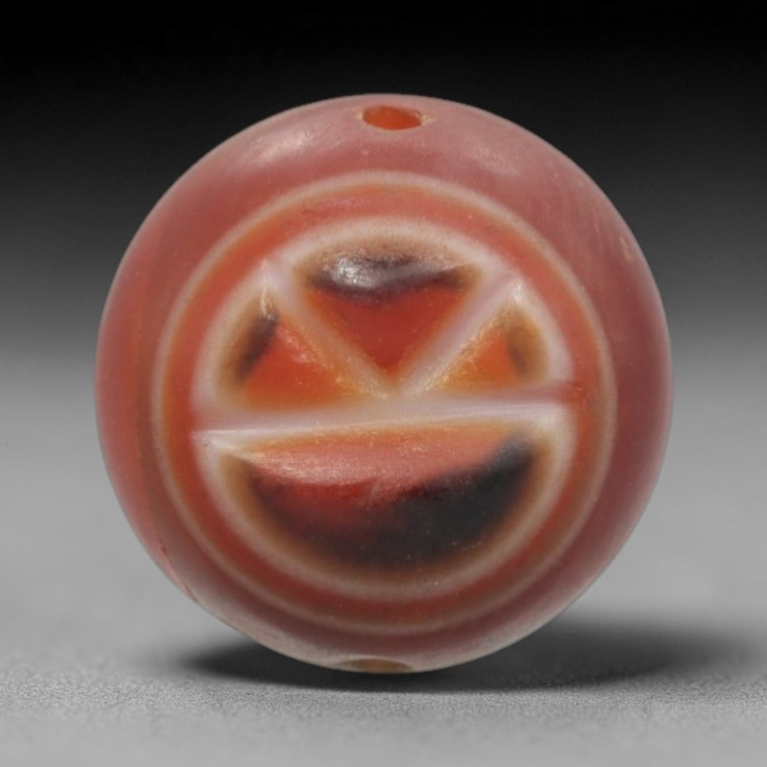 Antique Agate Citrus Slice Bead - Central Asian Gemstone Pendant, 8ZW: Carved from banded agate with a soft reddish-pink base and warm orange-black inclusions, this bead features a symmetrical citrus slice motif with three distinct wedge segments and a lower half-slice,