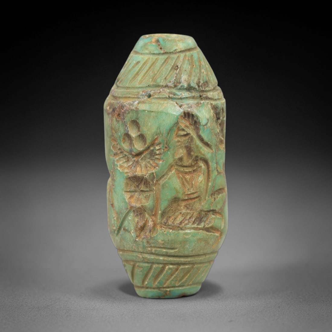 Ancient Lapis Cylinder Seal - Near Eastern Engraved Bead, 81AK: This artifact is a finely carved cylinder seal made from lapis lazuli, exhibiting a rich, deep blue hue with characteristic golden pyrite inclusions. The cylindrical surface is meticulously engraved w