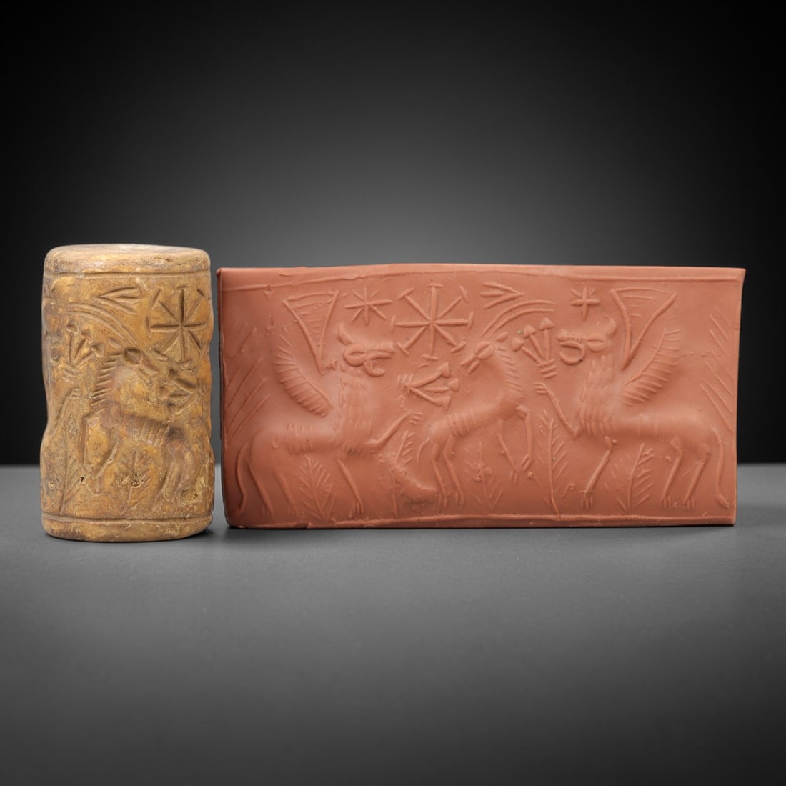Ancient Steatite Cylinder Seal - Mesopotamian Mythical Creature & Celestial Scene, 74AN: Carved from dense steatite, this ancient Mesopotamian cylinder seal features a dynamic linear relief composition of winged lion-headed mythical creatures flanking a central equine figure, interspersed