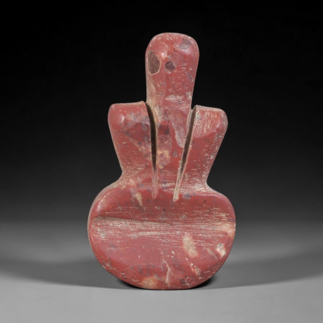 Ancient Tyet (Knot of Isis) Amulet - Egyptian Ritual Pendant, 77AP: This artifact is carved from variegated red stone with a weathered, earthy patina and natural mineral inclusions, exhibiting the iconic form of the Egyptian Tyet (Knot of Isis), consistent with ancien