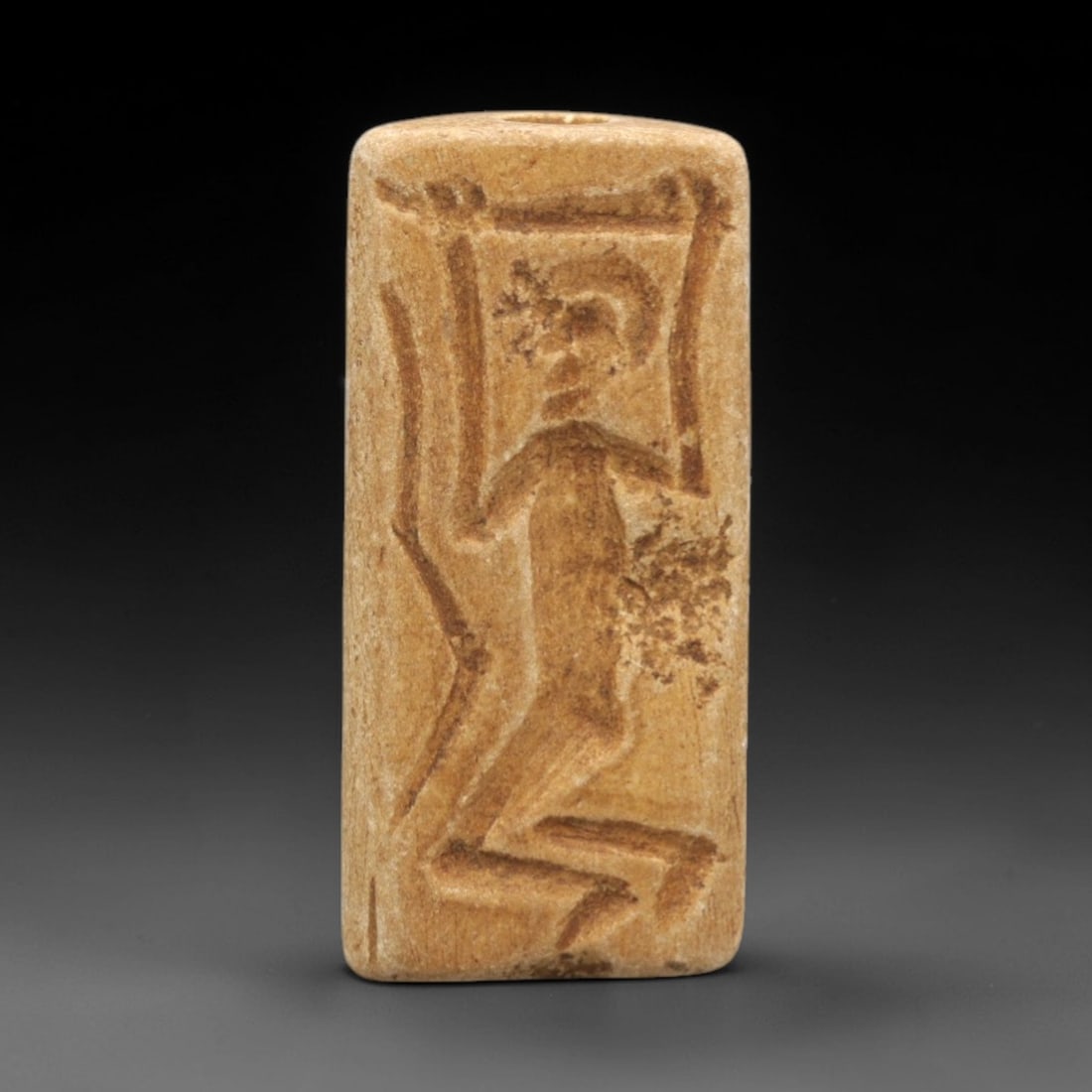 Ancient Stone Triangle Cylinder Seal - Near Eastern Figural & Animal Scene, 99ZR: Carved from warm tan stone with a naturally weathered, earthy patina, executed in a triangular cylindrical form characteristic of specialized Near Eastern cylinder seal craftsmanship. The seal's multi