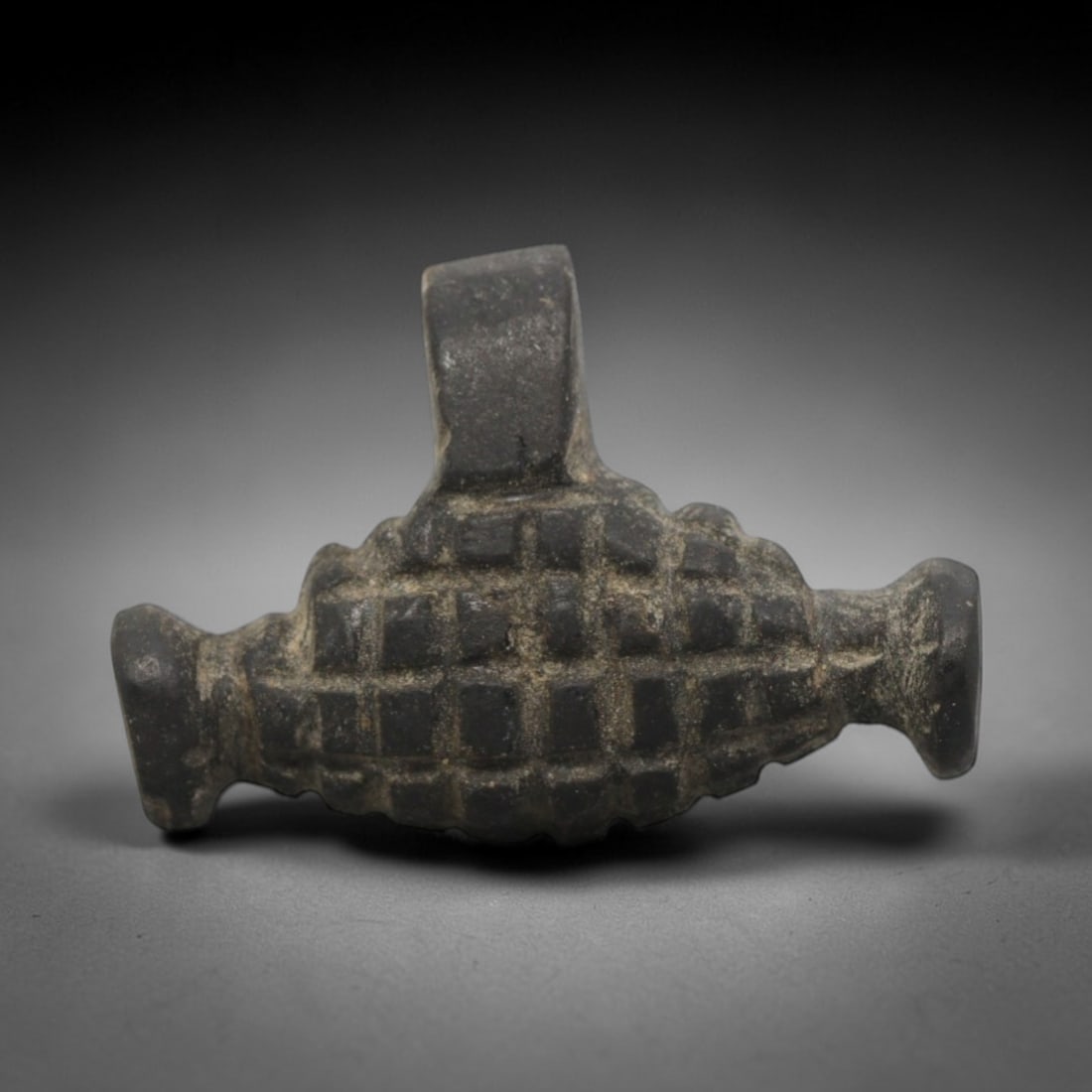 Ancient Black Stone Grid Amulet - Near Eastern Pendant, 68ZW: This amulet is carved from dense black stone, featuring a symmetrical form with a rectangular suspension loop at the top, a central body covered in a raised grid pattern, and two rounded terminal knob