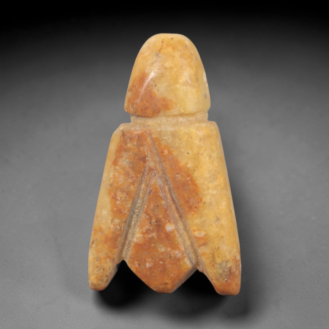 Ancient Steatite Fly Amulet - Near Eastern Figurine, 76AR: This artifact is carved from warm, variegated steatite with orange and cream tonal variations, exhibiting a smooth, aged patina and subtle mineral inclusions. The form is a stylized fly amulet, with a