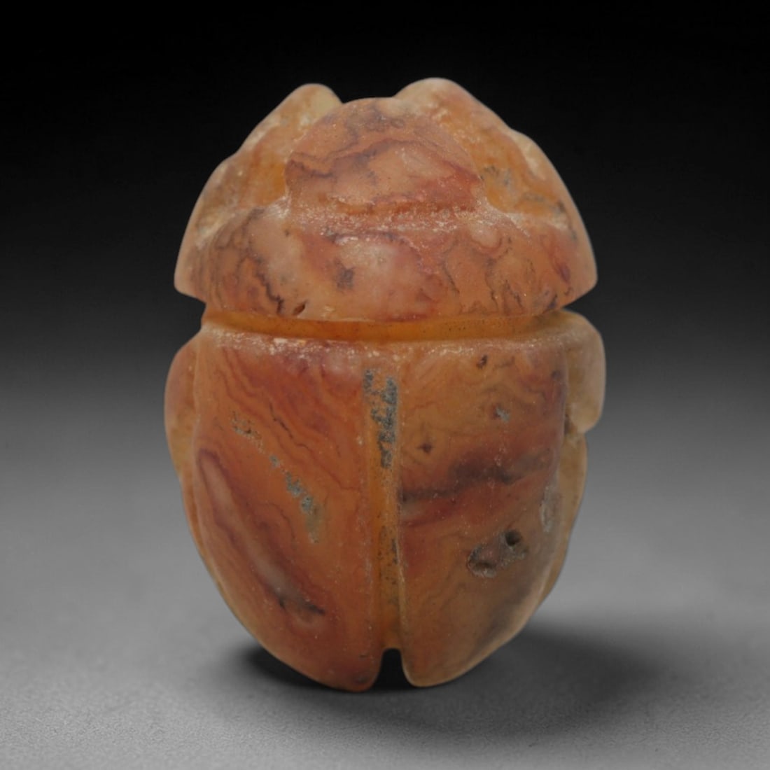 Ancient Banded Agate Scarab Amulet - Egyptian Ritual Pendant, 18ZV: This amulet is carved from warm banded agate, featuring rich orange and cream veining that mimics natural earth patterns. Shaped in the classic scarab beetle form, it has distinct elytra divisions, a