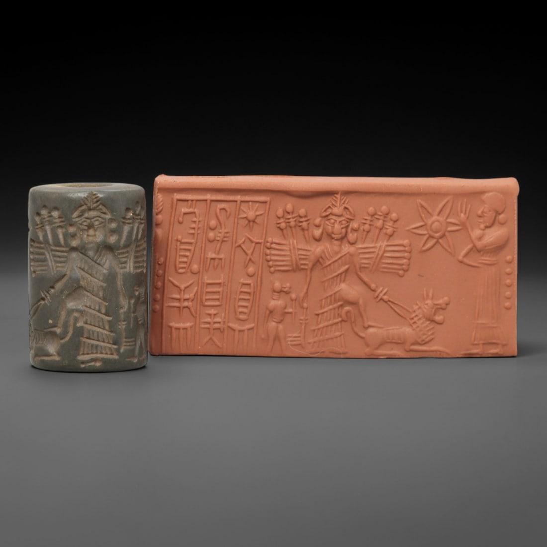 Ancient Steatite Cylinder Seal - Mesopotamian Winged Deity & Cuneiform Scene, 32AL: Carved from dark, finely grained steatite, this ancient Mesopotamian cylinder seal depicts a powerful mythological scene, executed with meticulous glyptic craftsmanship characteristic of the Neo-Assyr