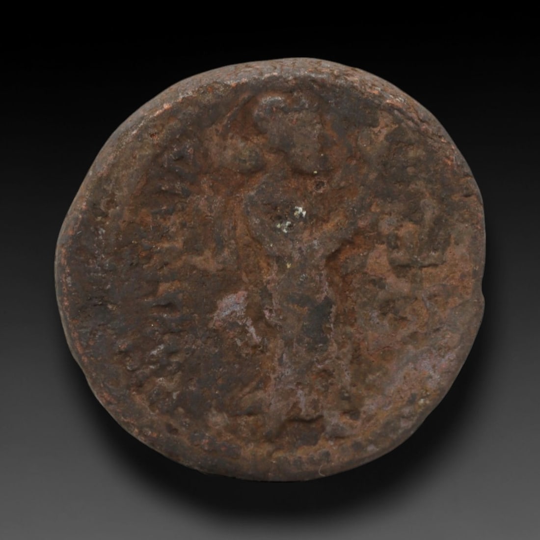 KUSHAN EMPIRE: Standing Divine Motif - Bronze Coin, 2nd-3rd Century CE, 23x22mm, 7.5g, 5AK: This compact bronze coin from the Kushan Empire features a standing divine motif, a key symbol of religious syncretism and royal piety in Kushan numismatics. The obverse displays a standing deity with