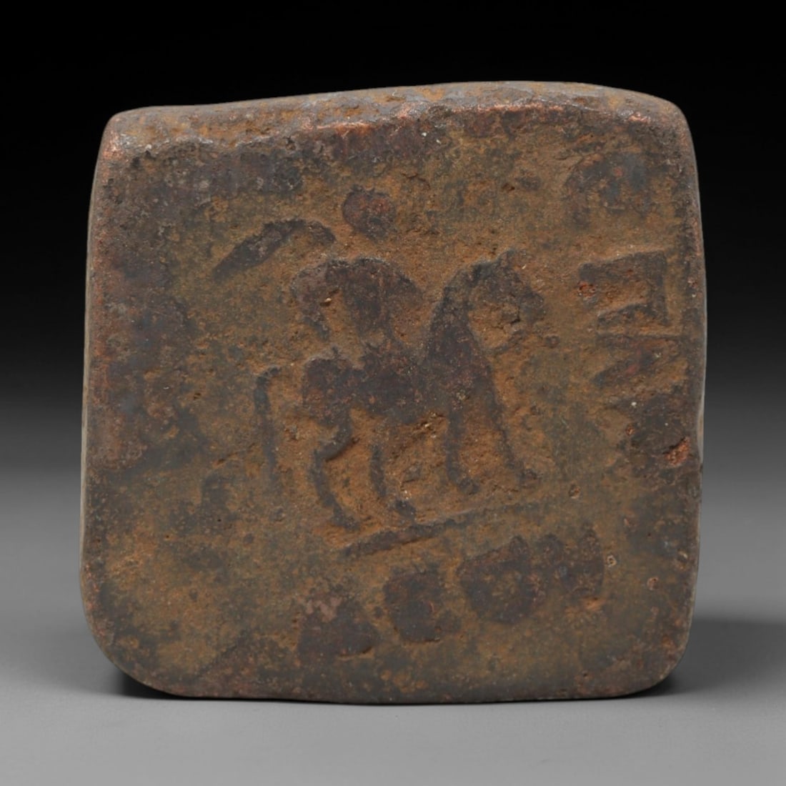 INDO-SCYTHIAN KINGDOM: Nomadic Sovereignty Pentachalkon Coin, 57 BC - 35 BC, 20mm, 7XS: Minted between 57 and 35 BC, this copper pentachalkon stands as a tangible link to the Indo-Scythian Kingdom's fusion of nomadic heritage and Hellenistic-influenced governance under King Azilises. As