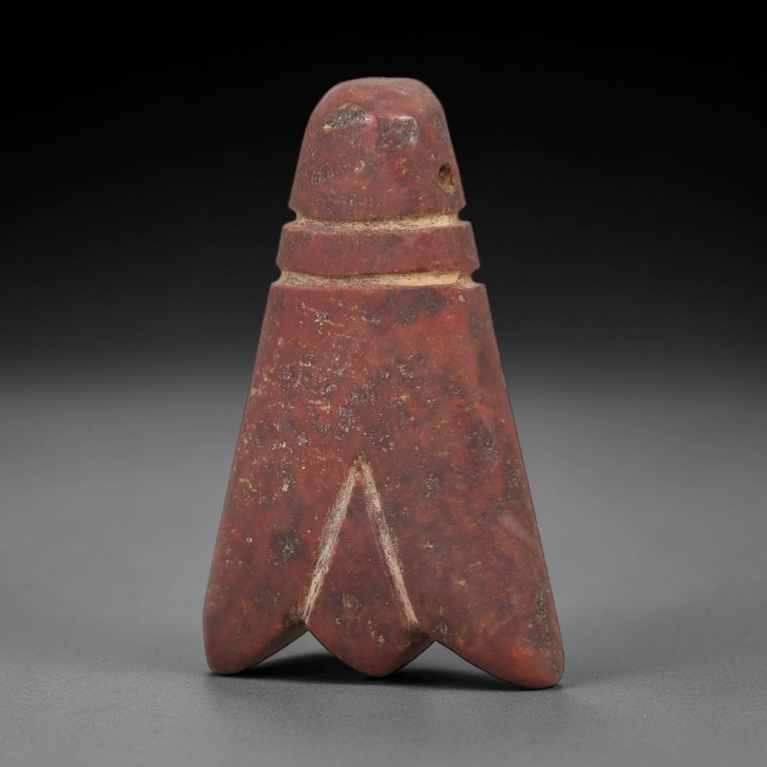Ancient Red Stone Fly Amulet - Near Eastern Pendant, 22AE: This artifact is a carved red stone fly amulet of Near Eastern origin, crafted from a rich terracotta-hued stone with natural mineral inclusions and earthy patination. Its stylized form features a rou