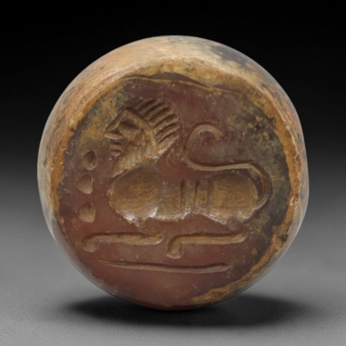 Ancient Agate Hemispherical Stamp Seal - Near Eastern Carved Amulet, 3ZQ: Carved from agate, this ancient Near Eastern hemispherical stamp seal features a finely detailed relief depicting a stylized animal form, typical of early Near Eastern glyptic art. The carving exhibit