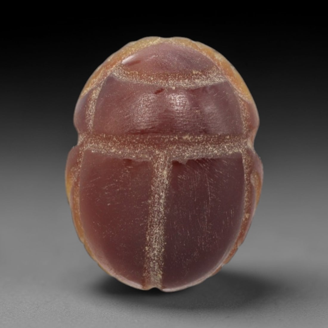 Ancient Agate Scarab - Egyptian Amulet Bead, 59XS: This amulet is carved from rich reddish-brown agate, exhibiting natural banding and a smooth, polished finish characteristic of ancient Egyptian glyptic craftsmanship. The form is a classic scarab bee
