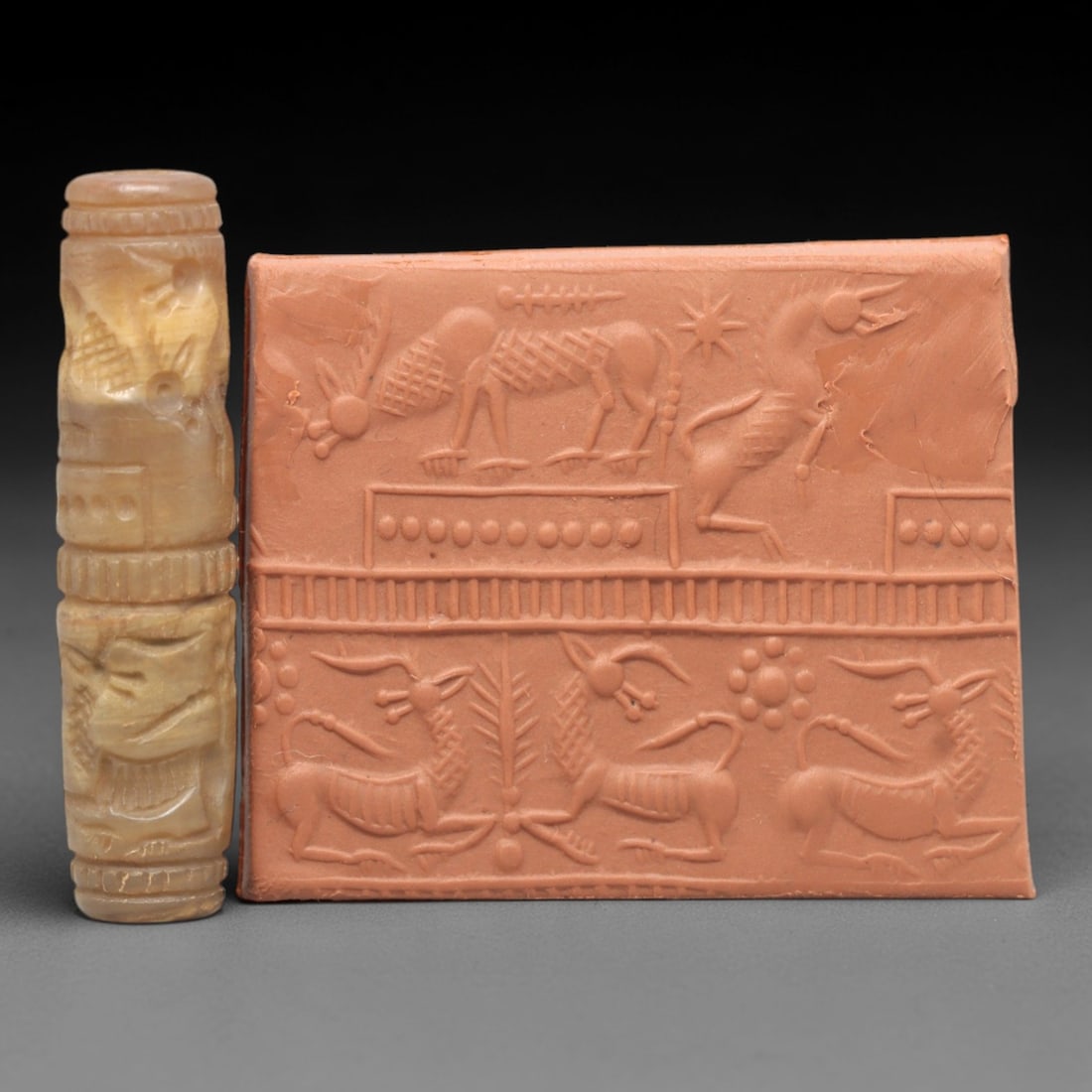 Ancient Chalcedony Cylinder Seal - Mesopotamian Pastoral Animal Procession Scene, 44AL: Carved from warm, honey-toned chalcedony, this ancient cylinder seal depicts a layered pastoral animal procession scene, executed with precise glyptic craftsmanship characteristic of the Early Mesopot