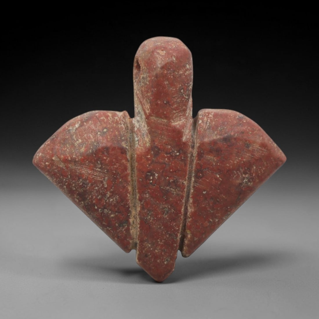 Ancient Egyptian Red Stone Fly Amulet - Carved Pendant Figure, 35ZV: This amulet is carved from a rich, deep red stone with natural mineral speckling and patination, likely brecciated jasper or red steatite, featuring the iconic ancient Egyptian fly form. The piece dis