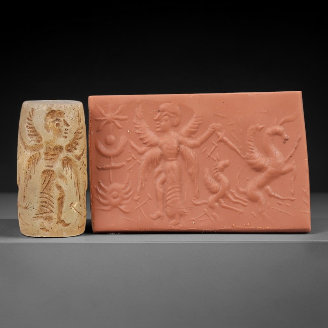 Ancient Rock Crystal Cylinder Seal - Mesopotamian Winged Deity & Mythical Creature Scene, 67AN: Carved from translucent rock crystal, this ancient Mesopotamian cylinder seal features a detailed linear relief composition of a multi-winged deity figure alongside winged horse and equine creatures,