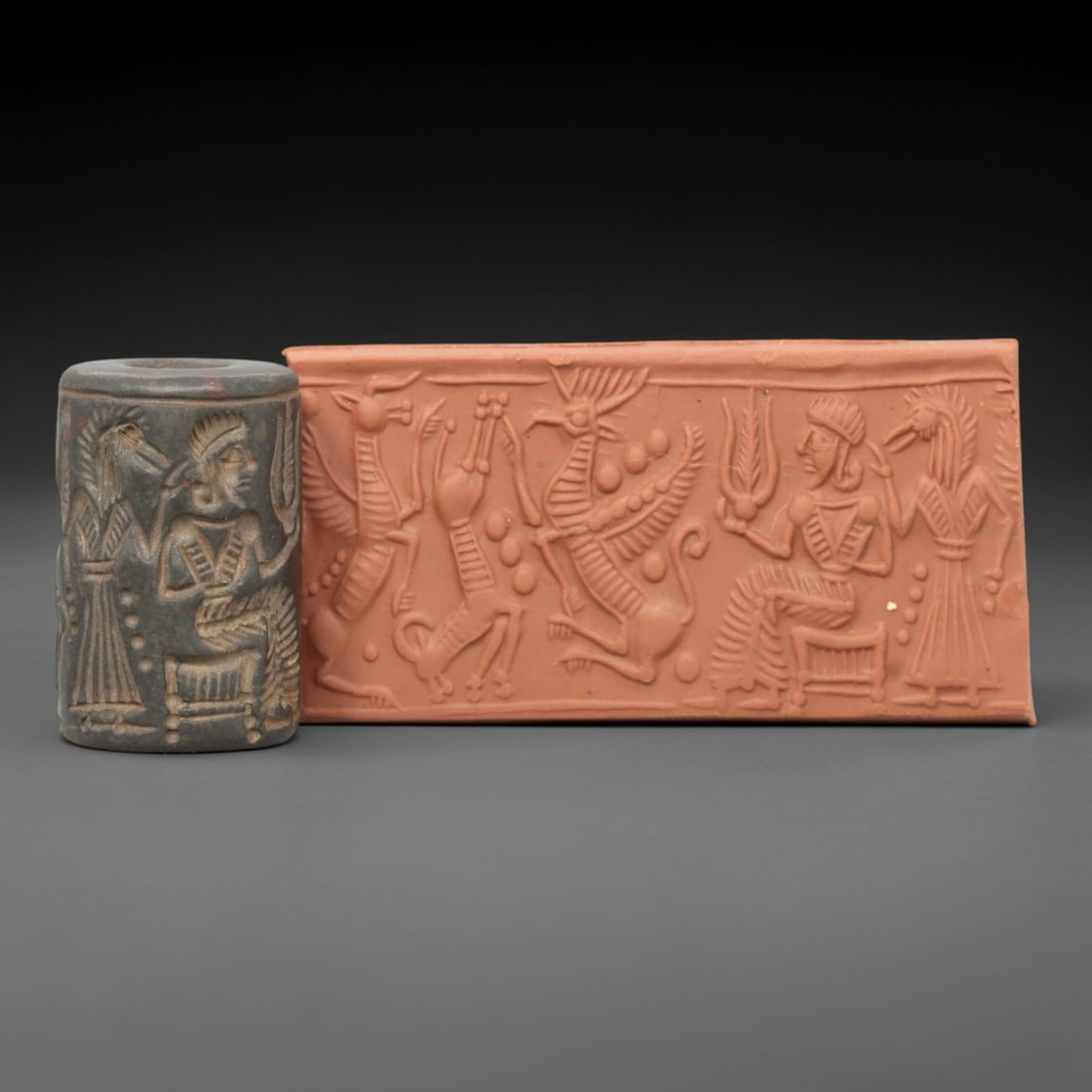 Ancient Steatite Cylinder Seal - Mesopotamian Mythological Procession & Deity Scene, 6ZP: Carved from dark, finely grained steatite, this ancient Mesopotamian cylinder seal depicts a rich mythological procession scene, executed with meticulous glyptic craftsmanship characteristic of the La