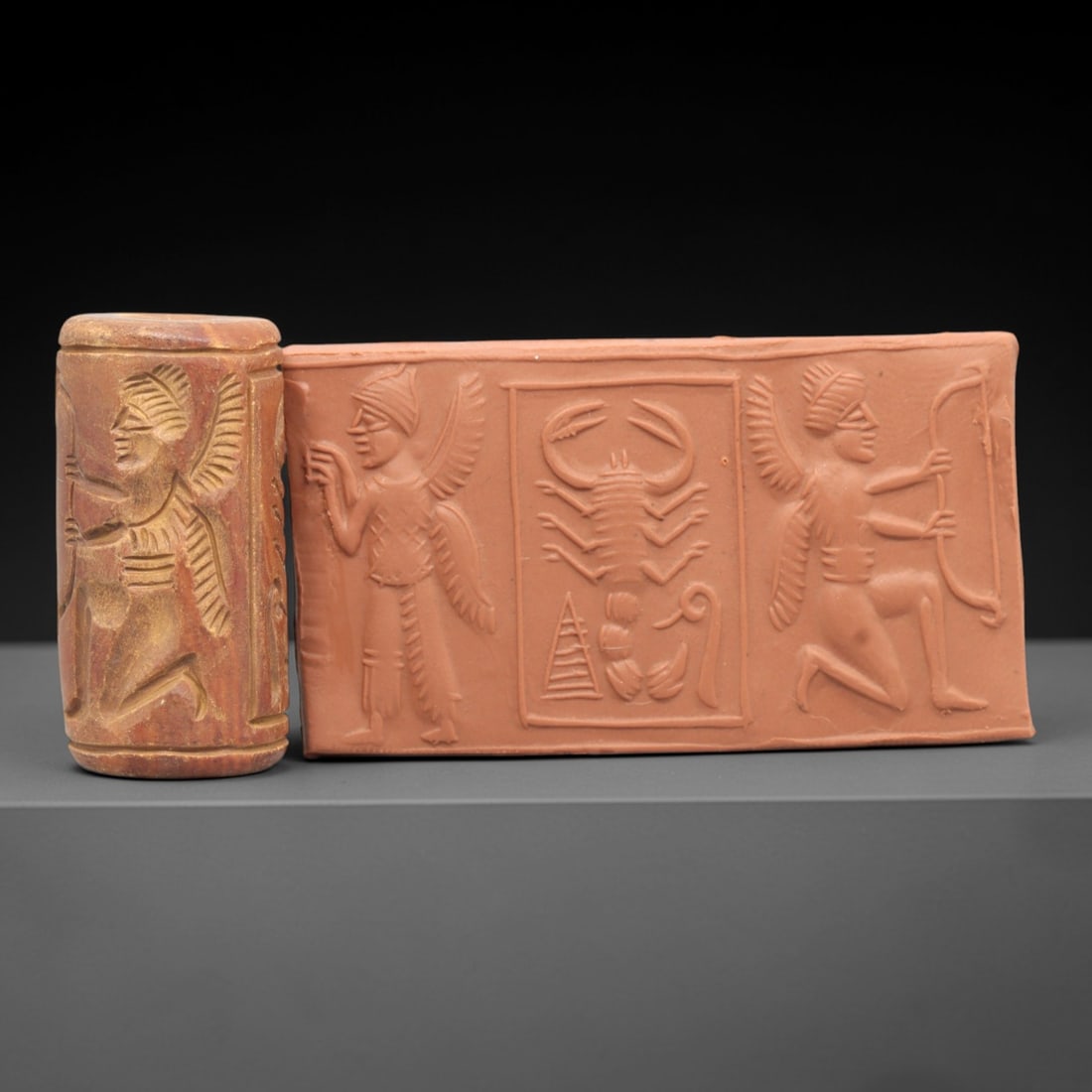 Ancient Steatite Cylinder Seal - Mesopotamian Scorpion Scene, 42AL: Carved from warm, variegated steatite, this ancient Mesopotamian cylinder seal depicts a detailed mythological scene centered on a scorpion, executed with meticulous glyptic craftsmanship characterist